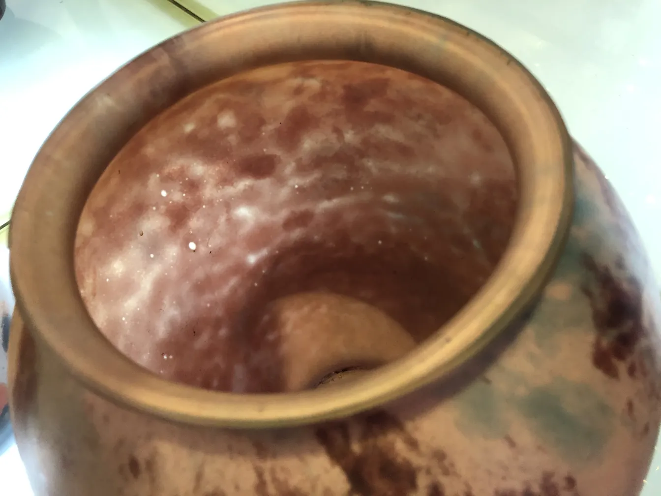 Glass signed Lorrain with soft tones inside, in an antique setting.