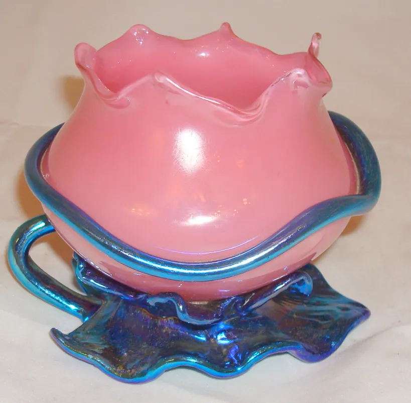 antique signed Loetz glass featuring a pink flower design and blue base