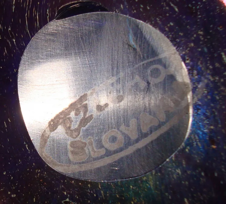 Detailed authenticity seal on antique Loetz glass