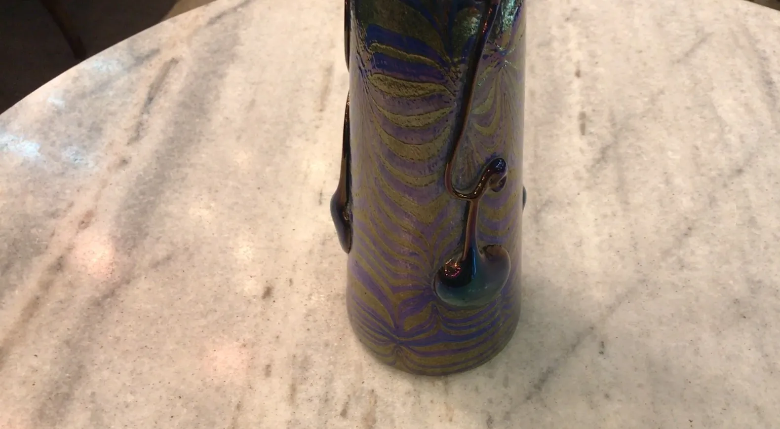 SIGNED GLASS Loetz with unique colorful design in an antique setting.