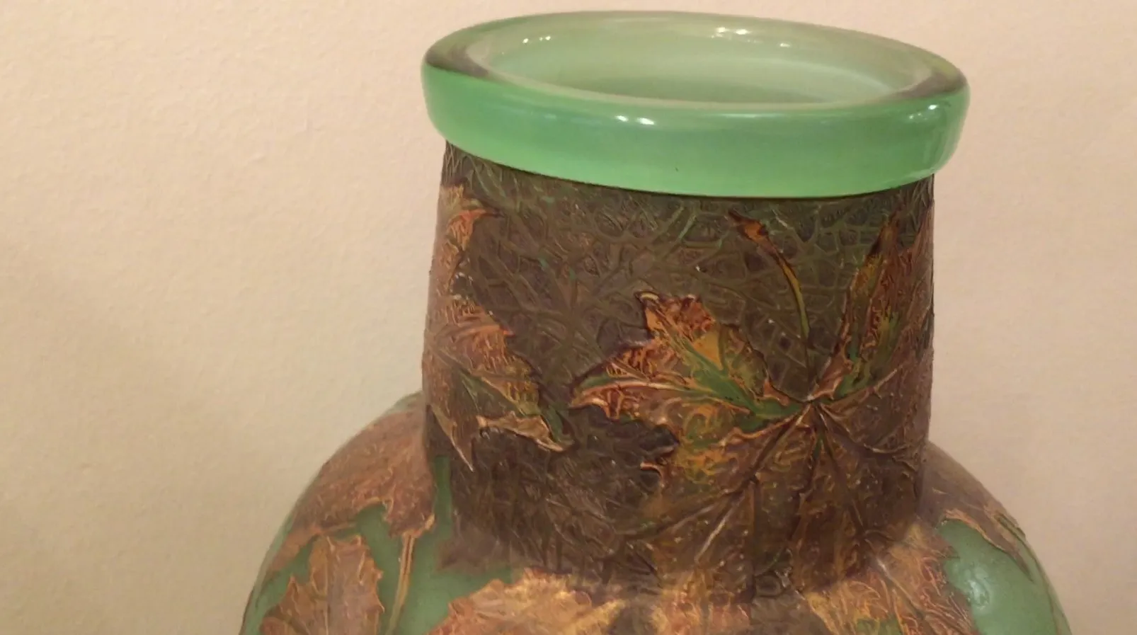 Antique glass vase signed LEGRAS with decorative details.