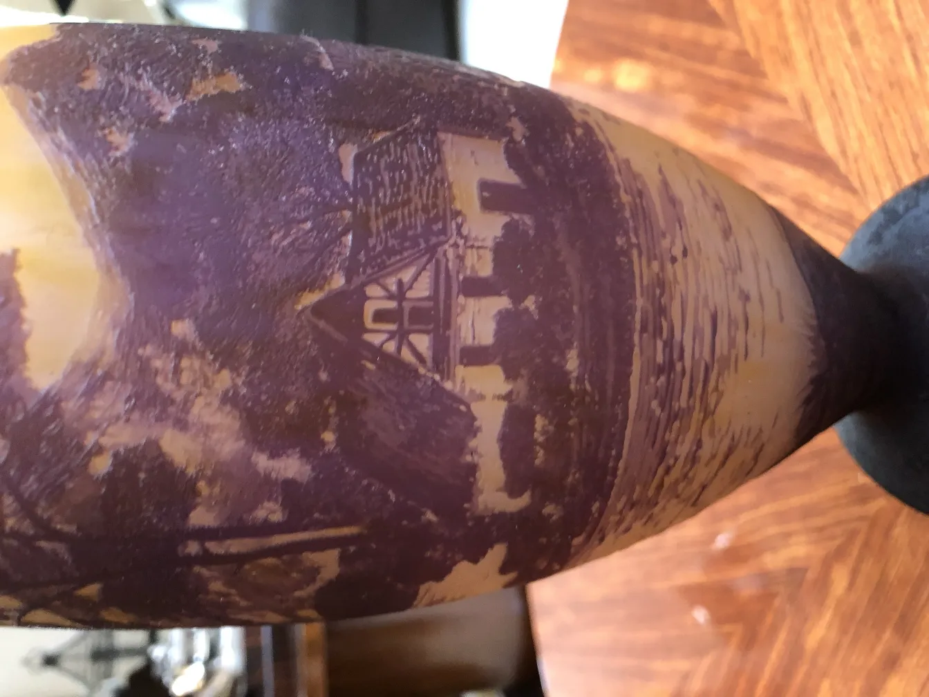 signed glass by Richard featuring intricate ancient design