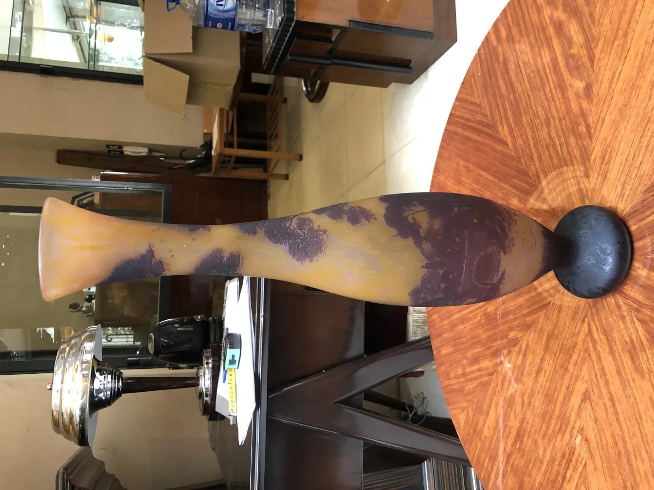 Antique Richard signed vase in yellow and purple hues, decorative, set in an elegant environment.