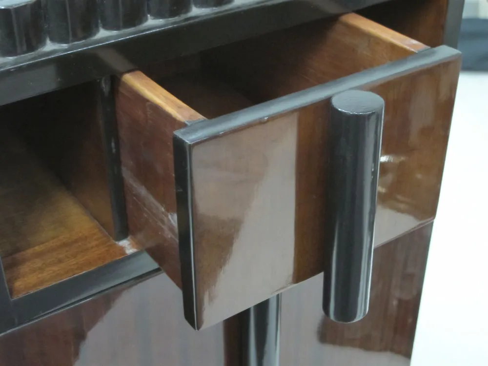 antique bedside table featuring a dark wood drawer