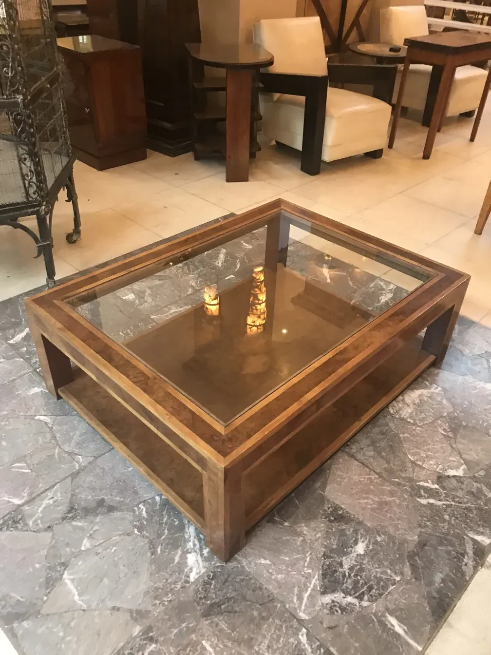 antique coffee table with glass and decorative details in a stylish setting