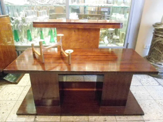 antique coffee table with elegant design in a cozy setting with candelabra