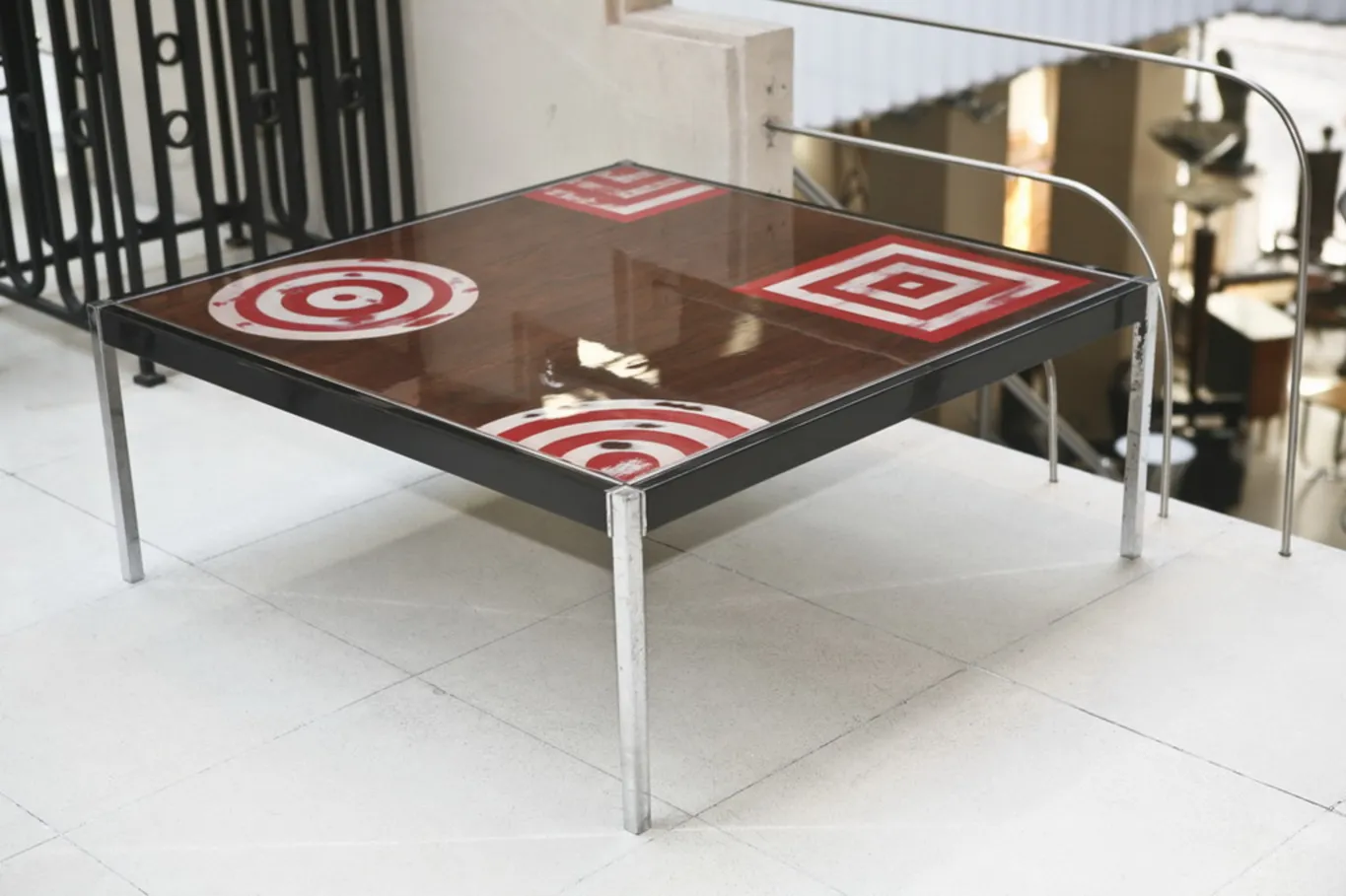 antique coffee table with red patterns and squares