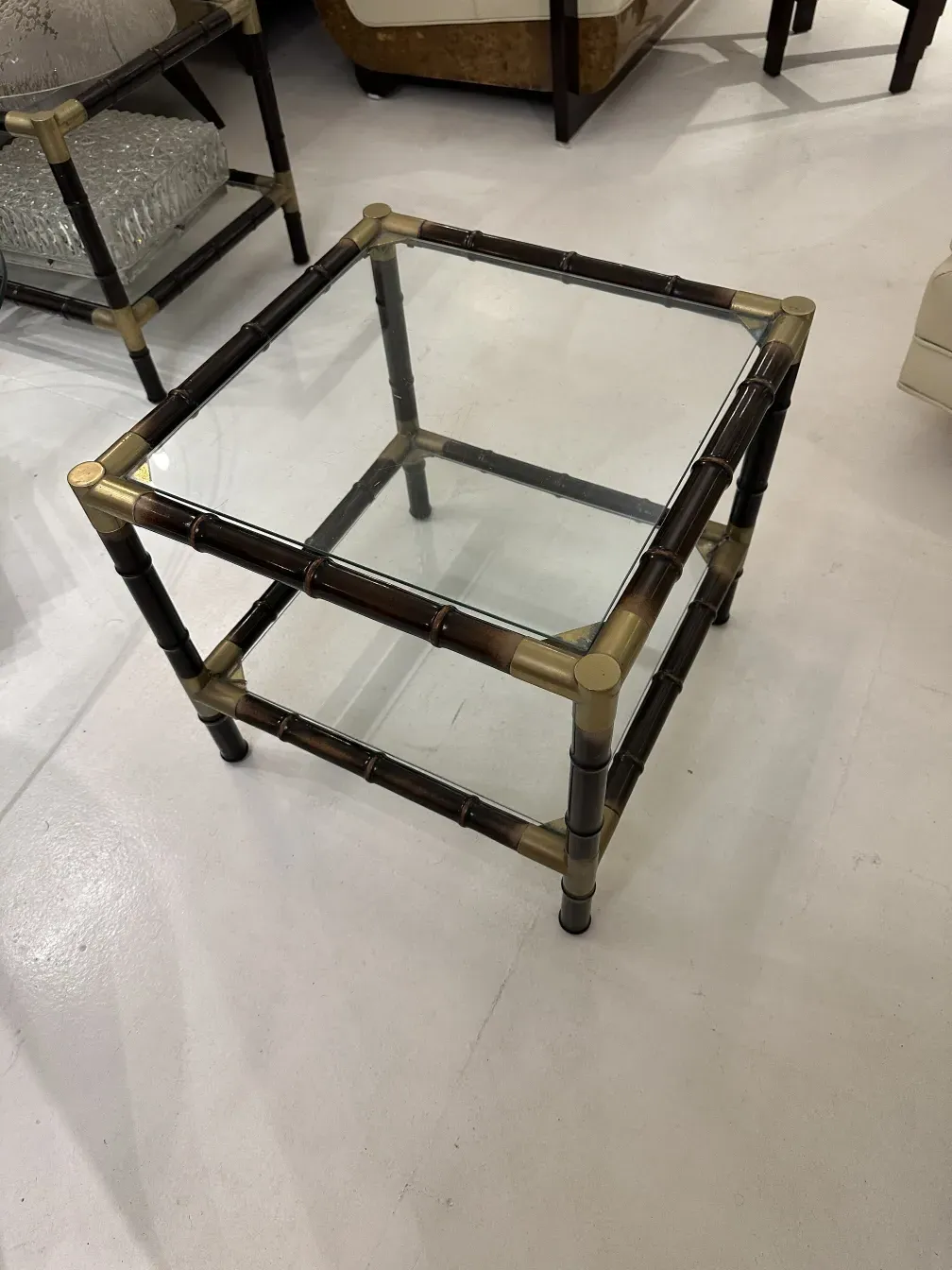 Antique coffee table with elegant design and glass