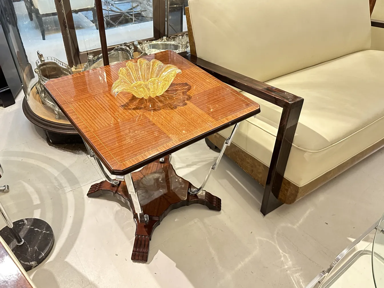 Antique small table in an elegant setting, adorned with a yellow centerpiece
