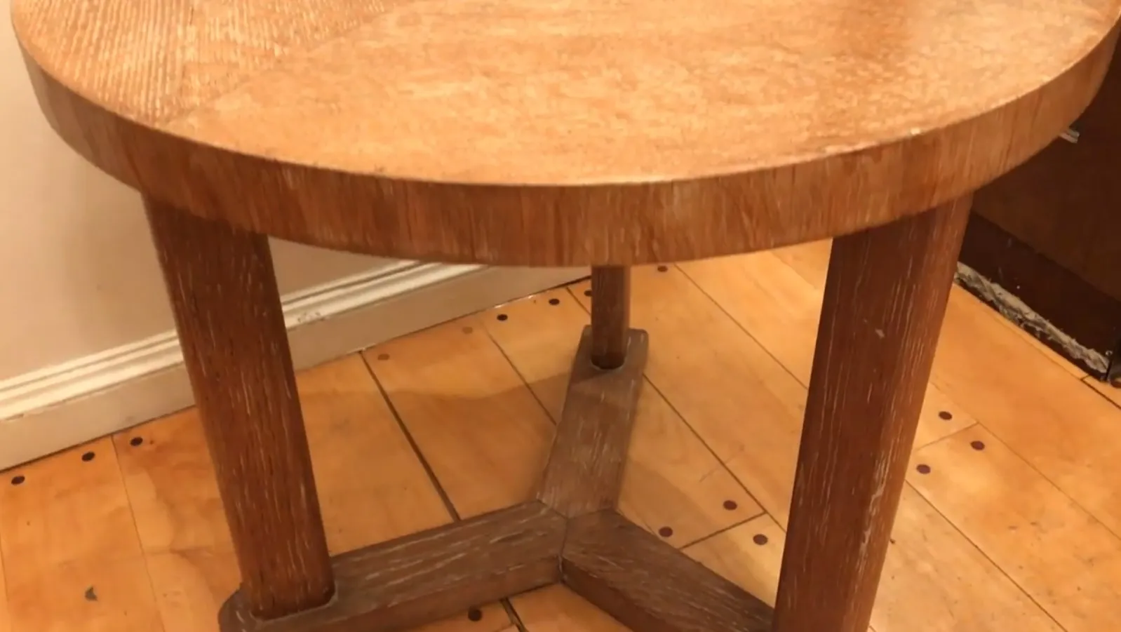 antique small table with sturdy legs and simple design