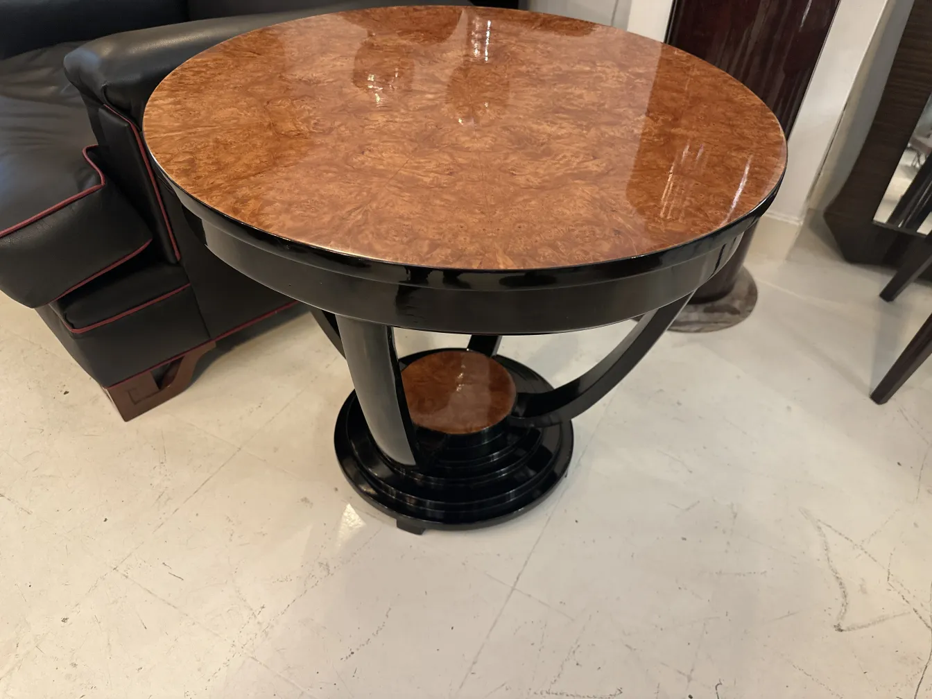Antique small table with round design in modern setting