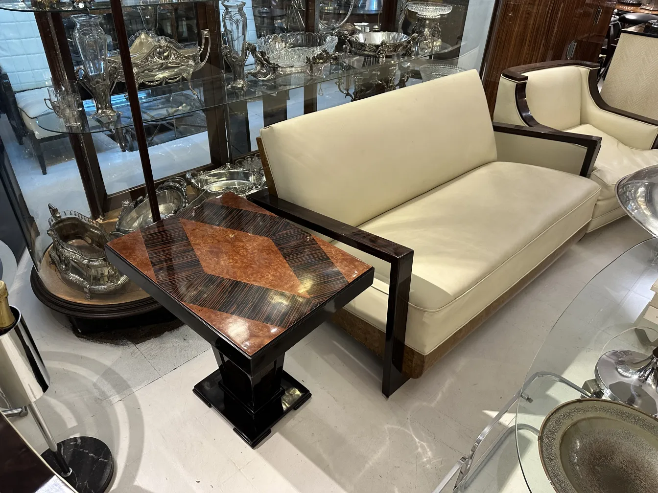 Antique small table featuring decorative patterns and geometric shapes.