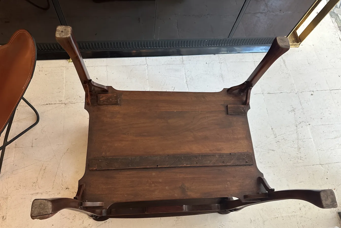 antique small table with stylized legs, elegant setting