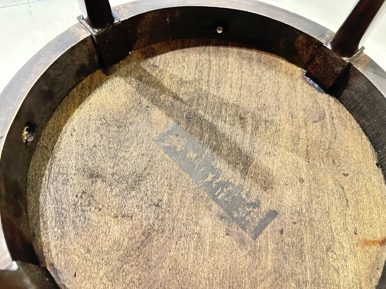 Close-up of an antique small table with texture details