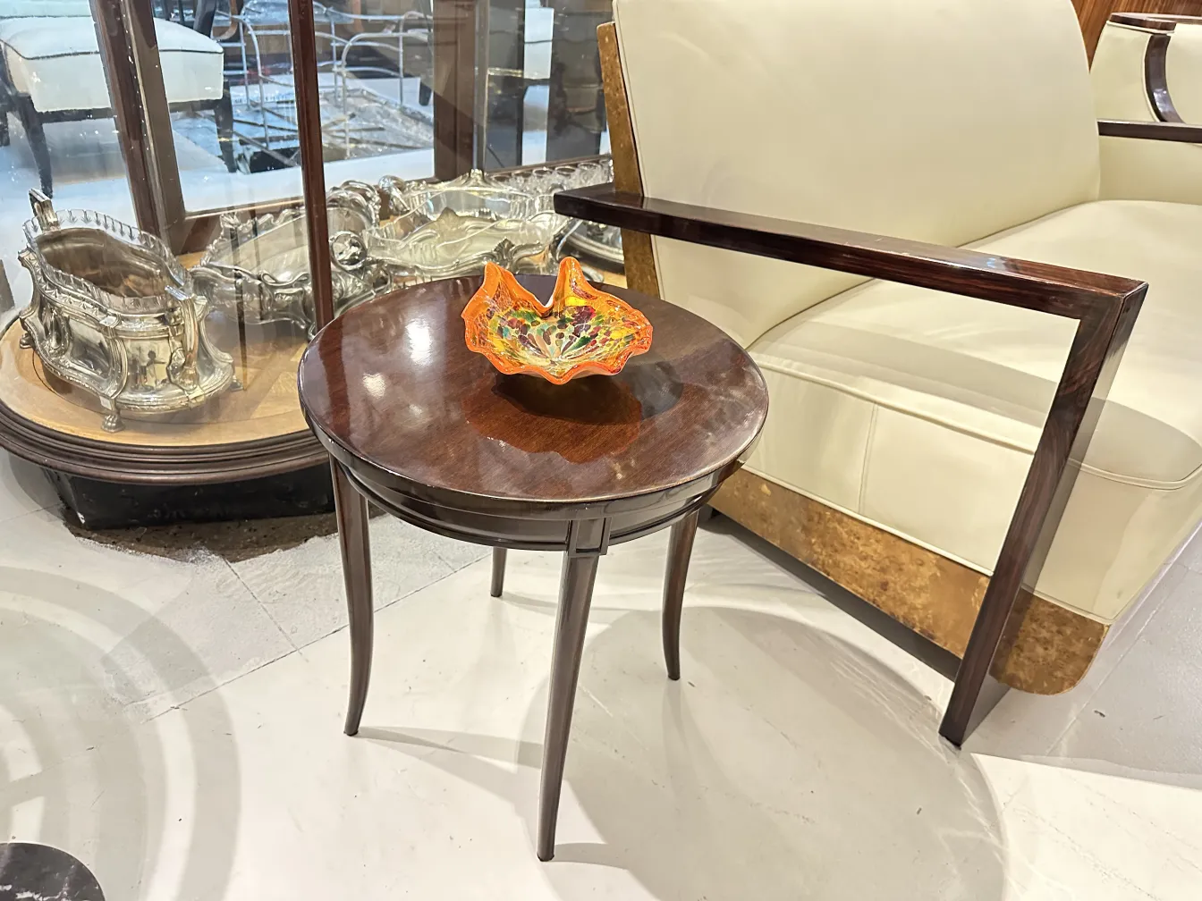 Antique small table with colorful decoration and elegant outline.