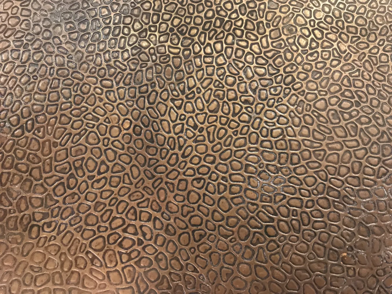 antique small table with intricate textured design