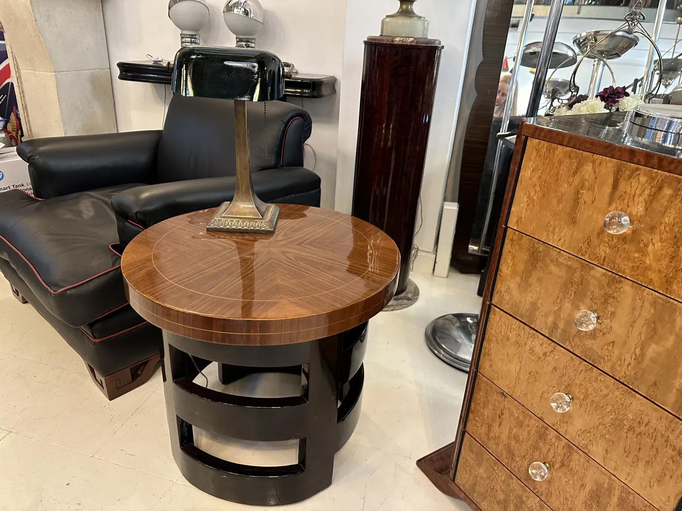 antique round small table with a lamp in an elegant setting