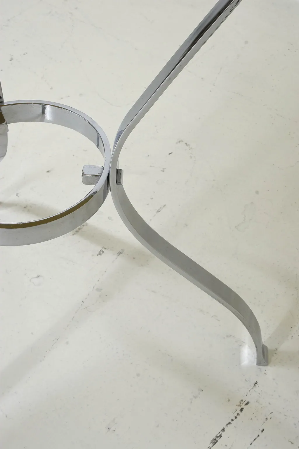 antique small table with curved legs in a cozy setting.