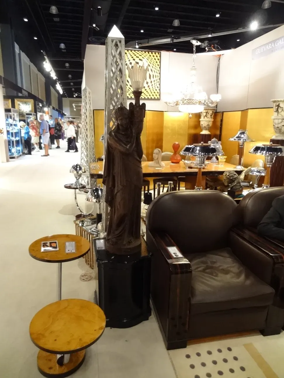 antique small table with circular shape and simple decoration, set in a room