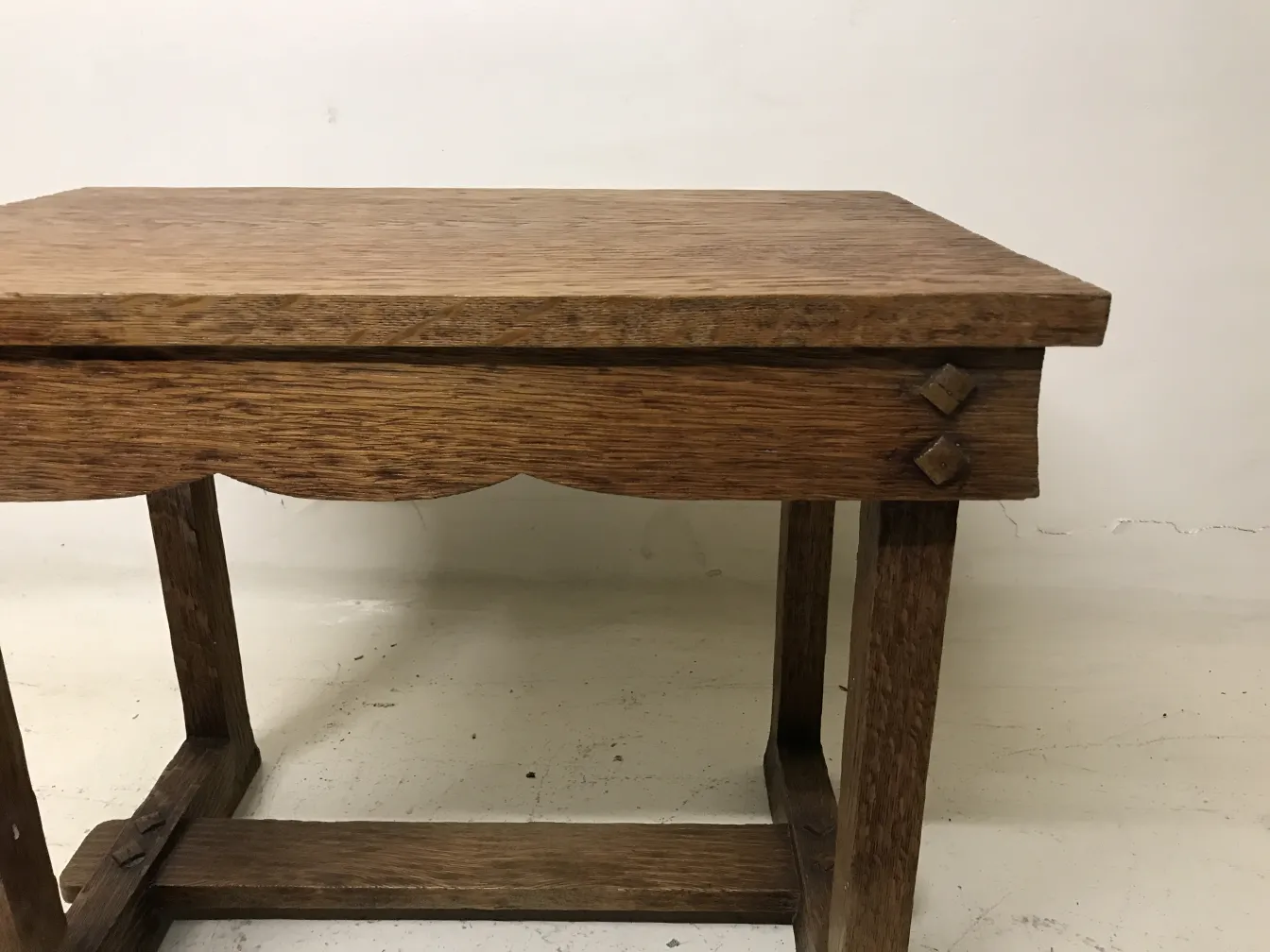 Antique small table with simple style and decorative details.