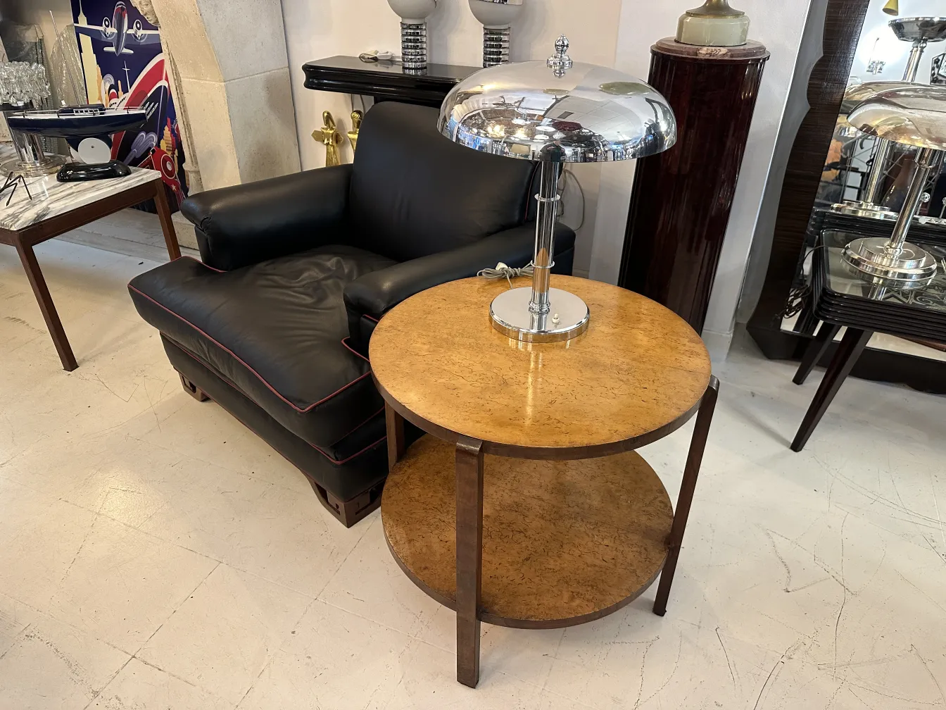 antique small table with lamp, modern decor in background