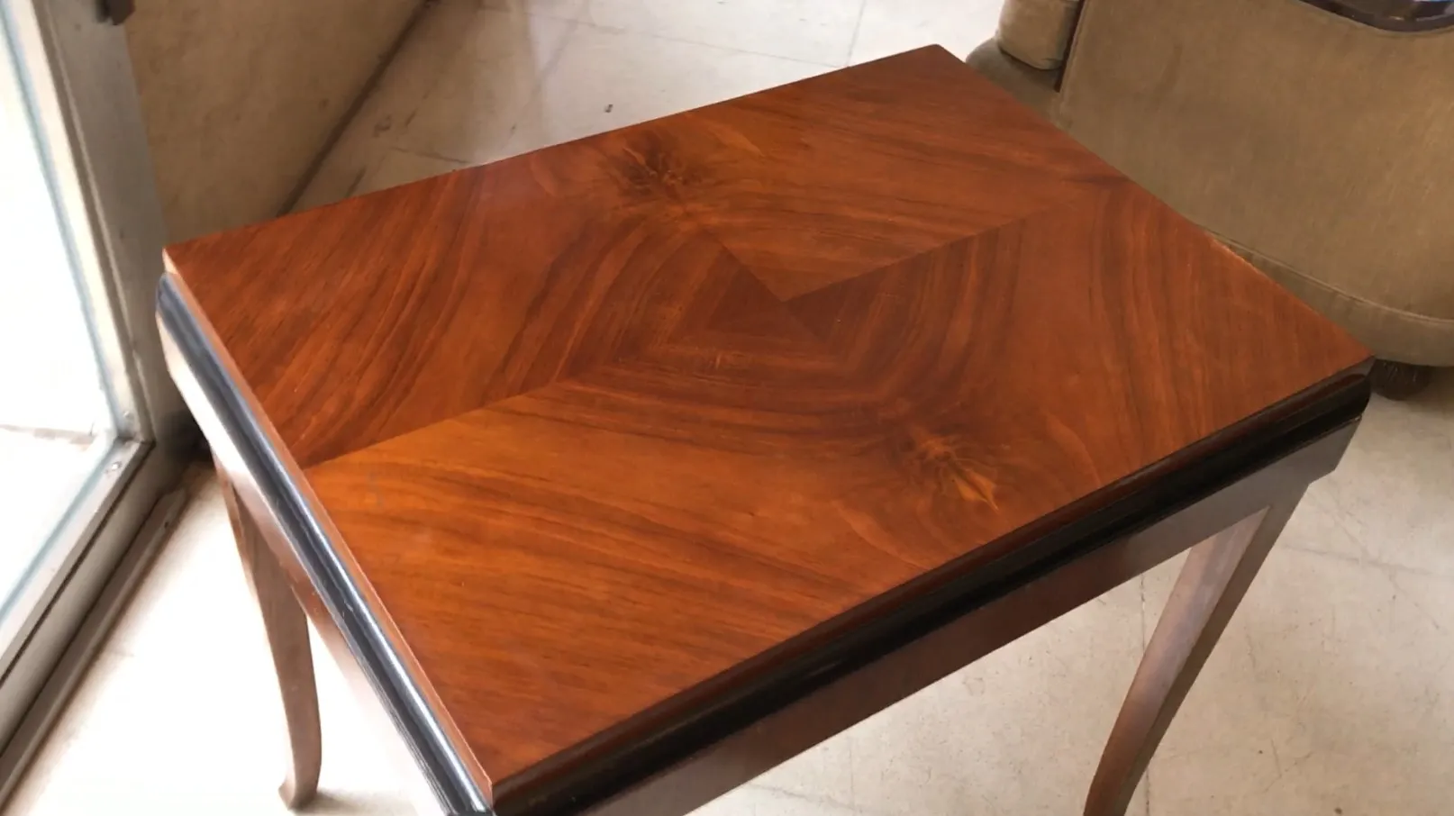 antique small table with geometric design in a cozy setting