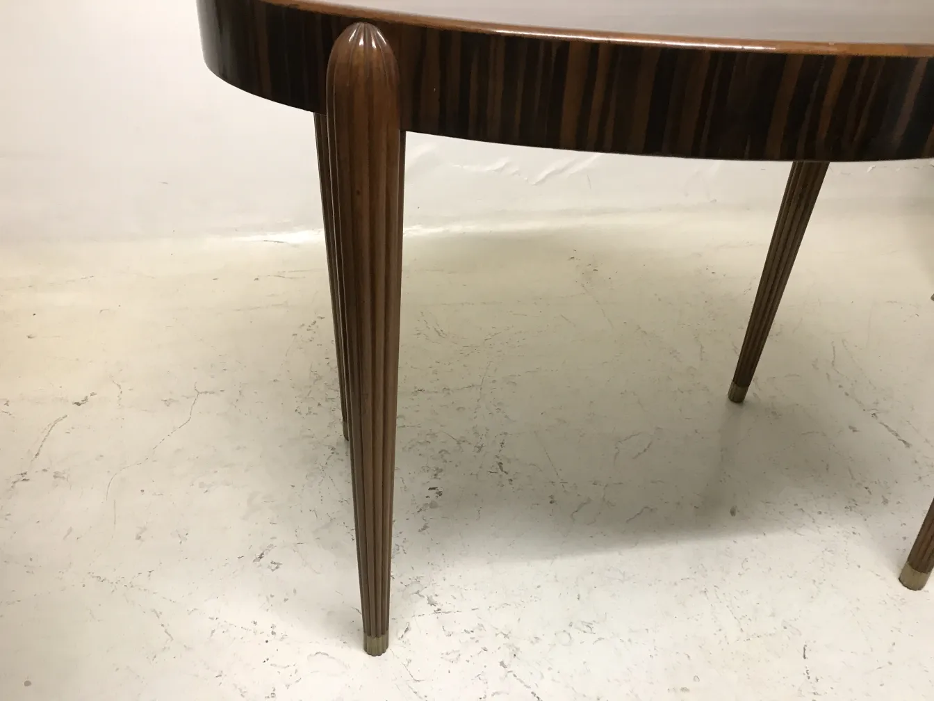 antique small table with slim legs, side view