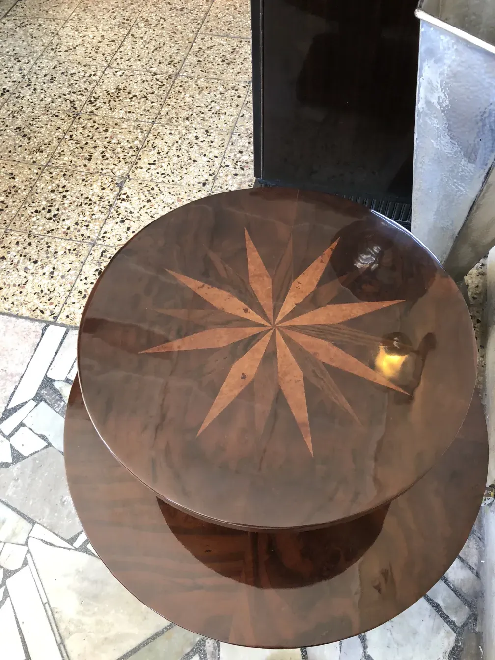 antique small table featuring a star-shaped design on top