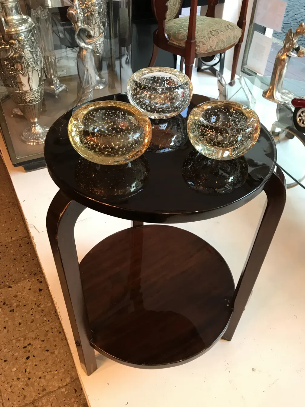 Antique small table featuring a classic design with decorative bowls.