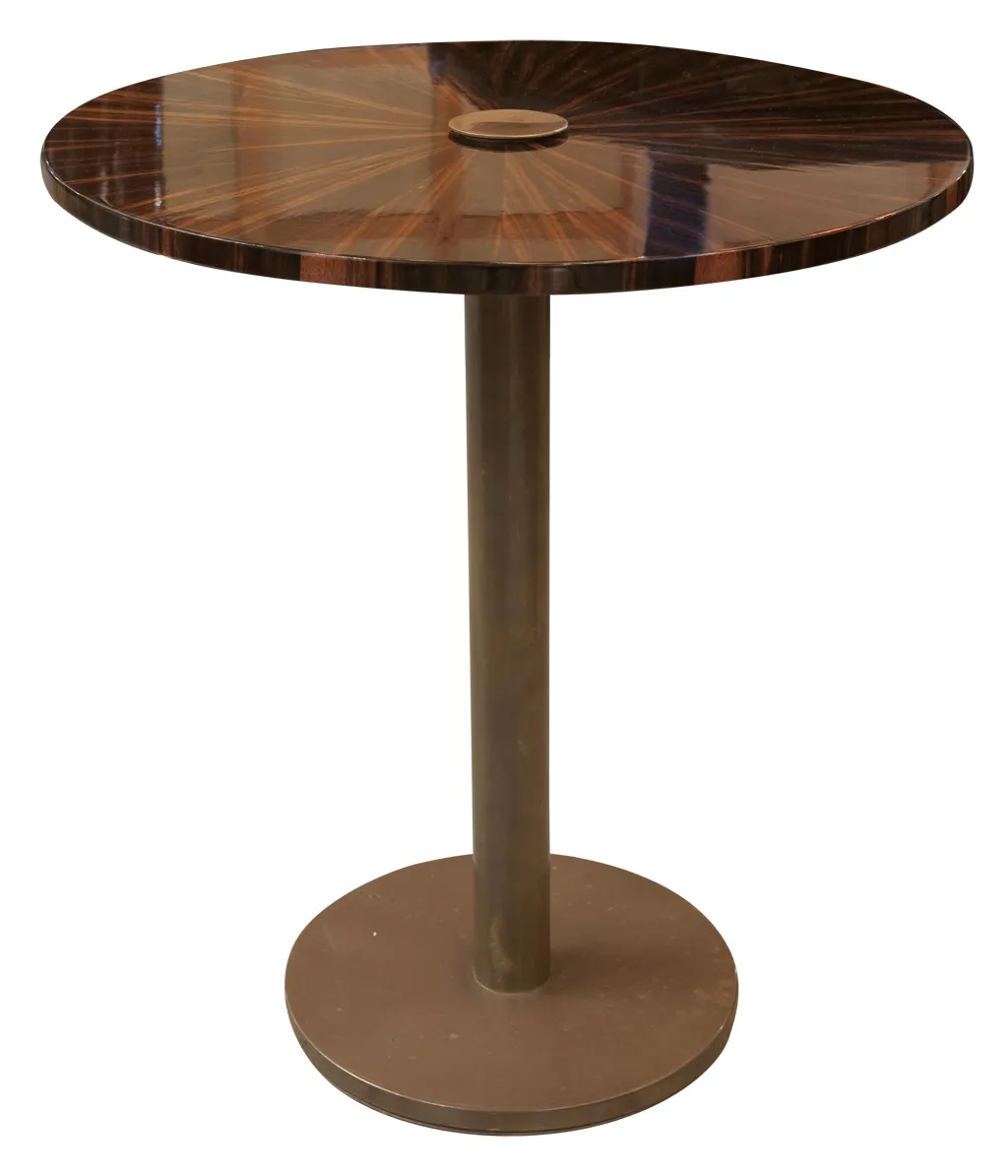 antique round small table with unique details and a cozy atmosphere.