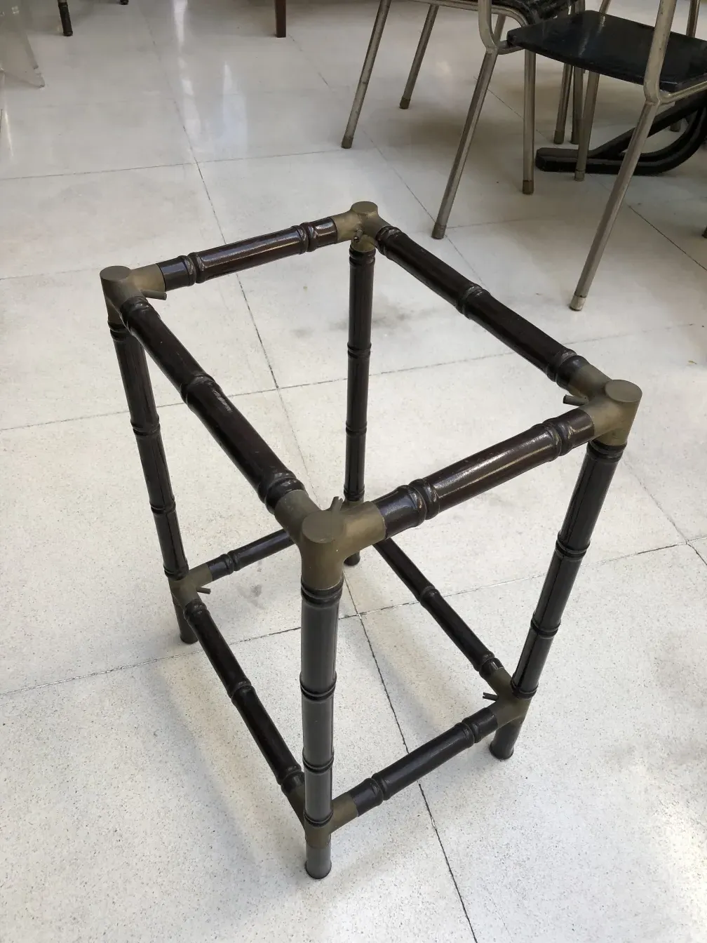 Antique small table with elegant legs in a bright environment.