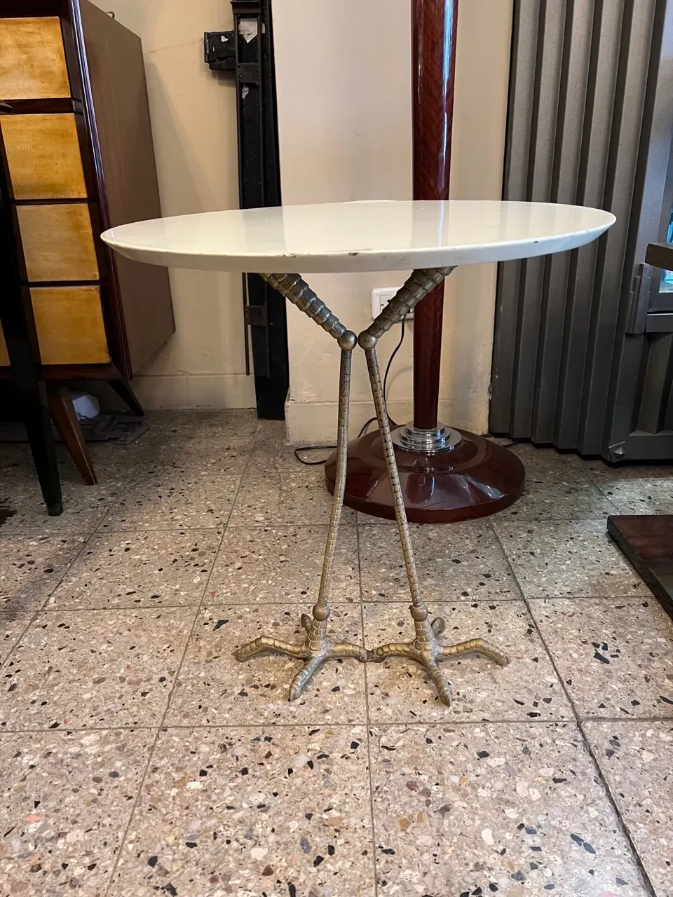 antique table with decorative legs in a cozy setting