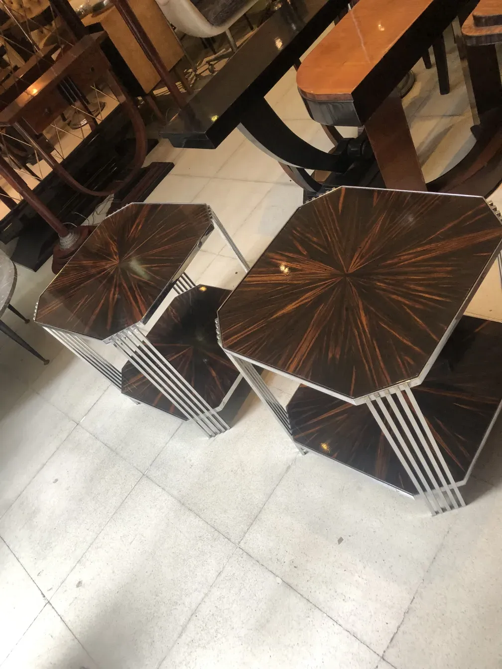 Two antique decorative small tables in a vintage setting