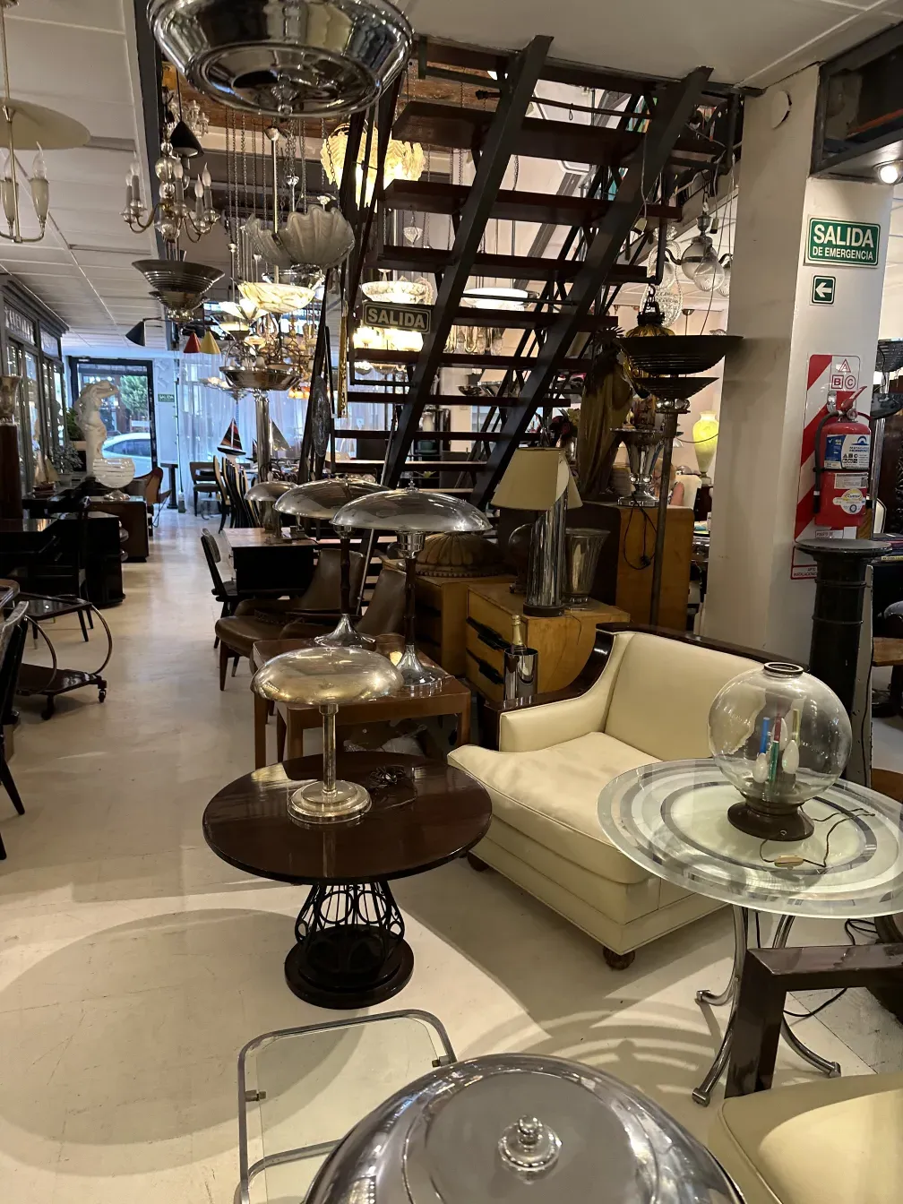 2 antique small tables with elegant design in a decorative setting