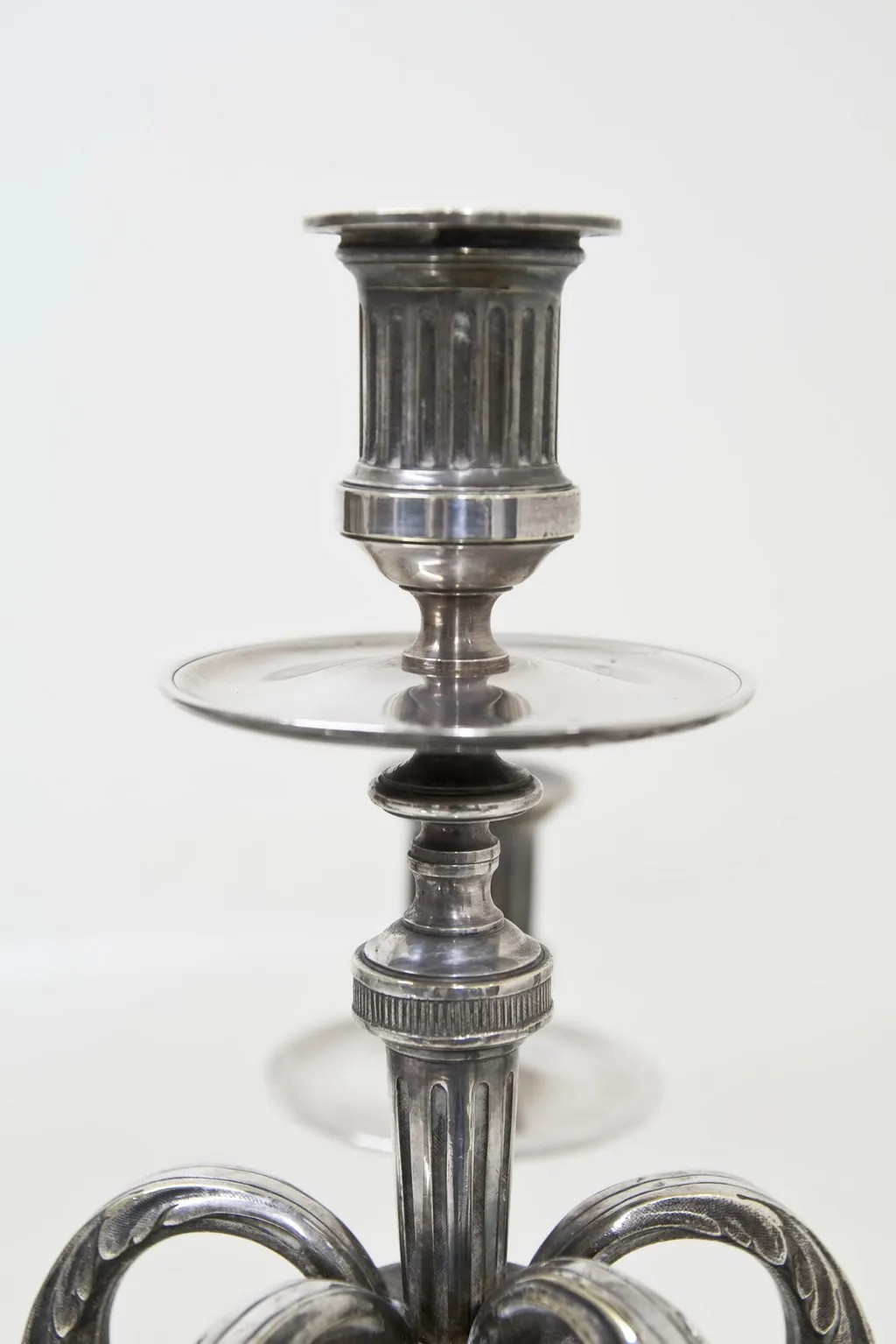 two decorative antique candlesticks with details