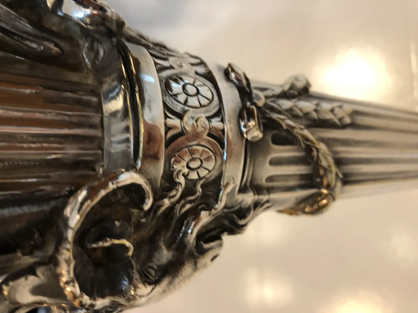 Detail of two antique candelabras with intricate design