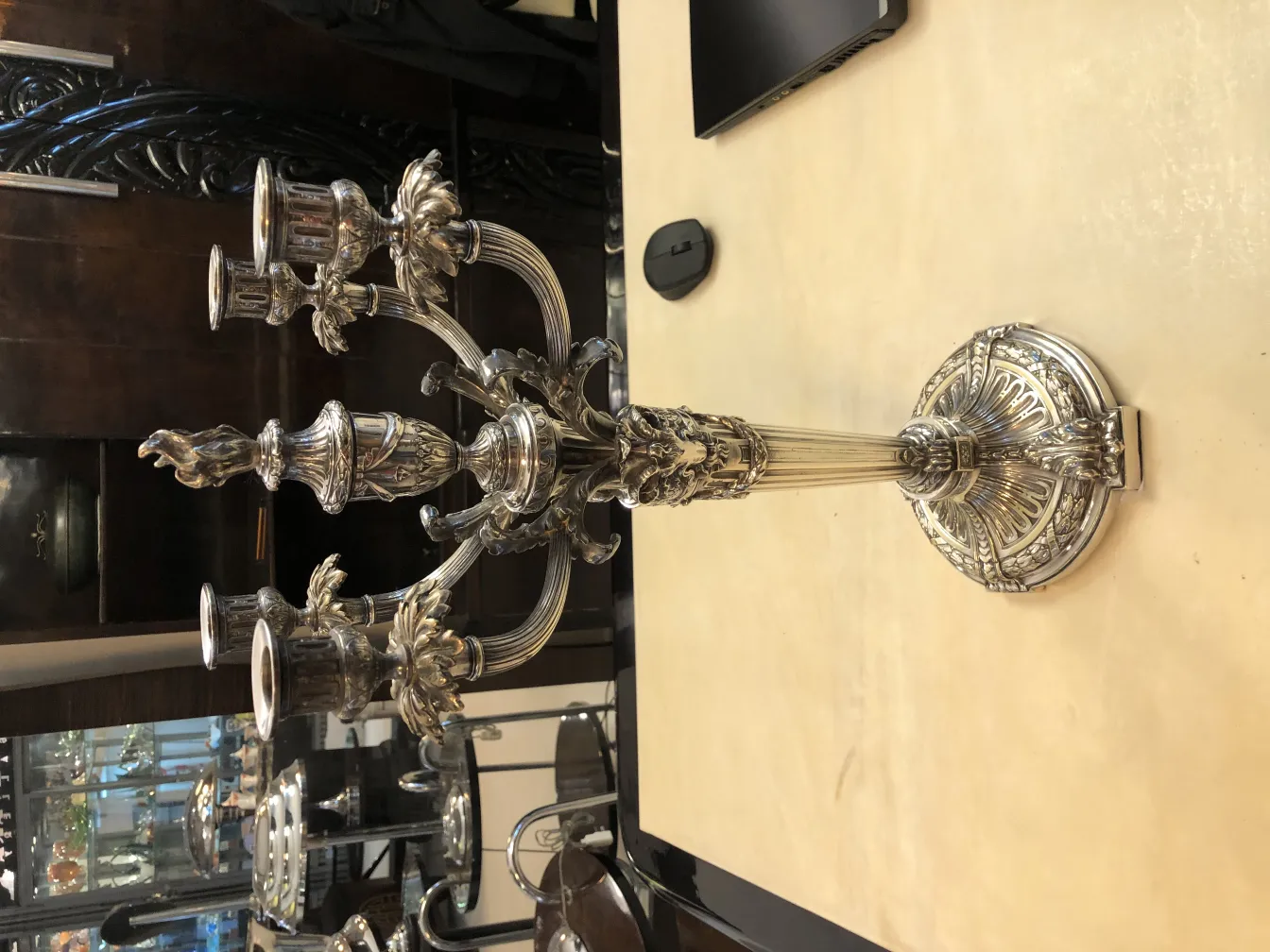 two decorative antique candelabras with intricate details