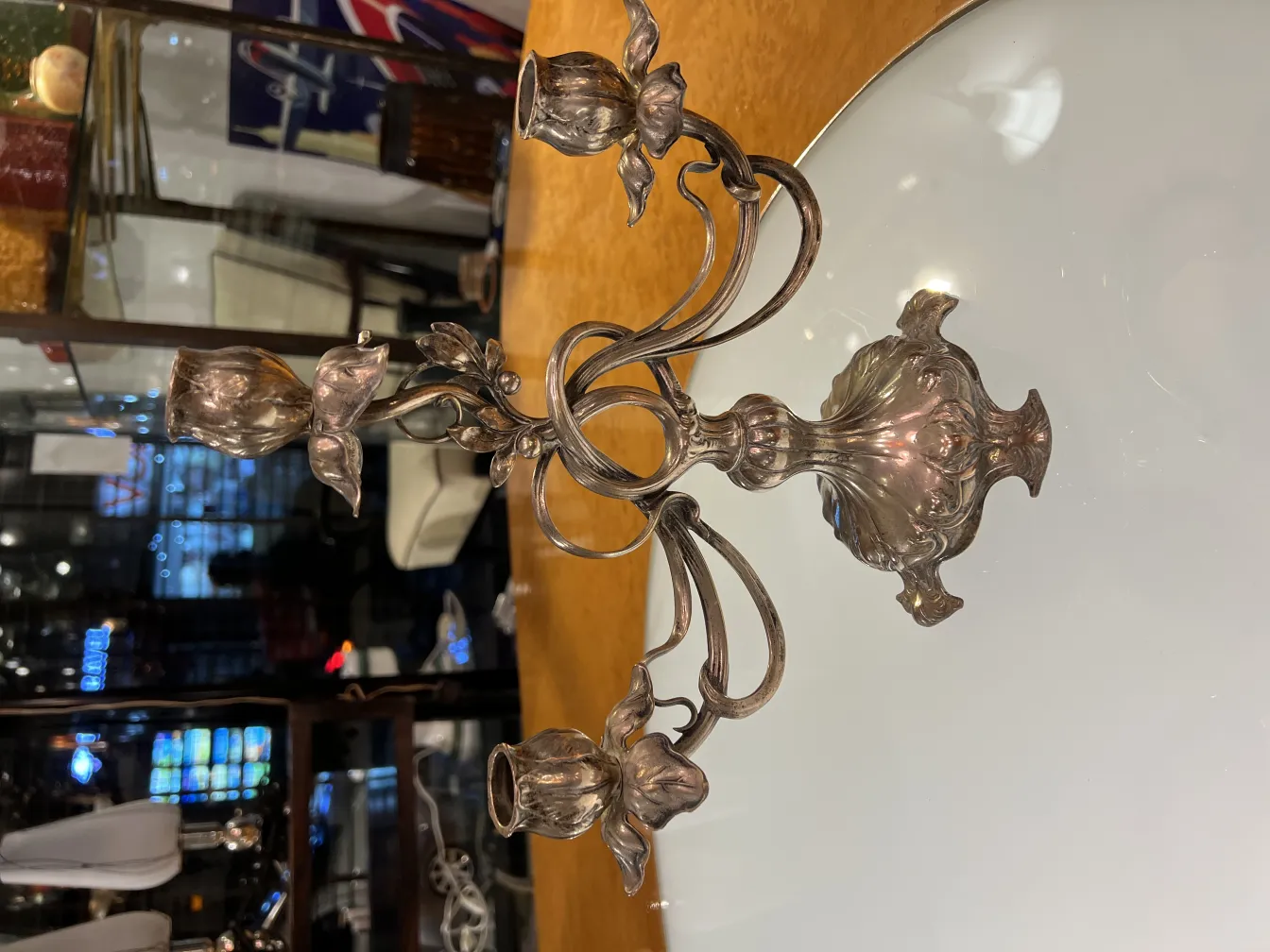 two antique candelabras with floral design