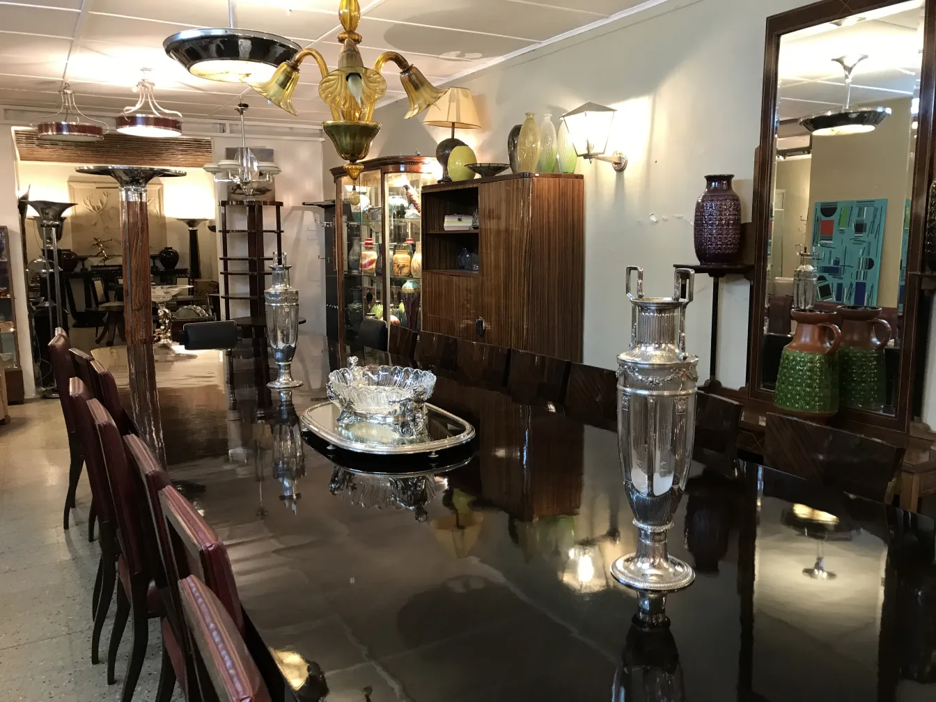 two antique decorative vases on a table