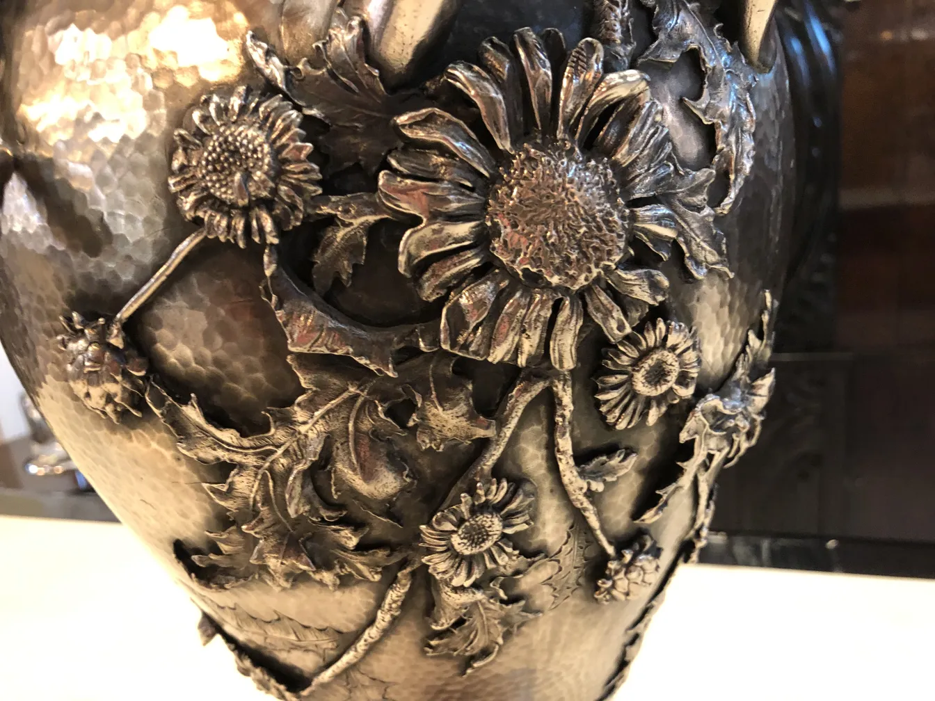 2 antique vases adorned with floral designs