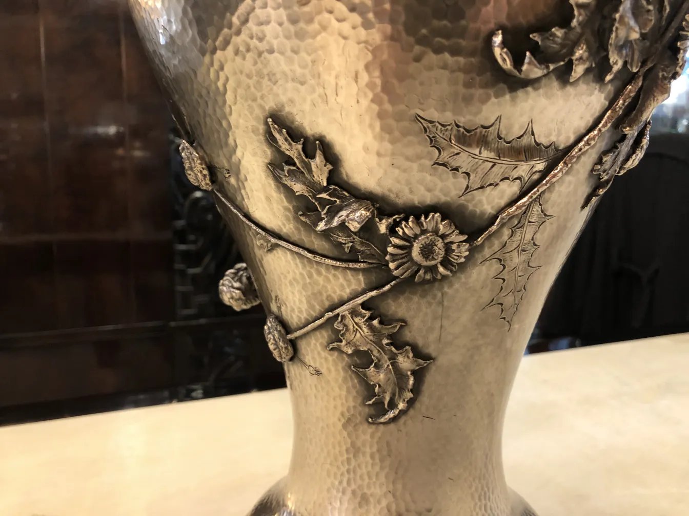 Antique vases adorned with leaves, Art Nouveau style, in an elegant setting.