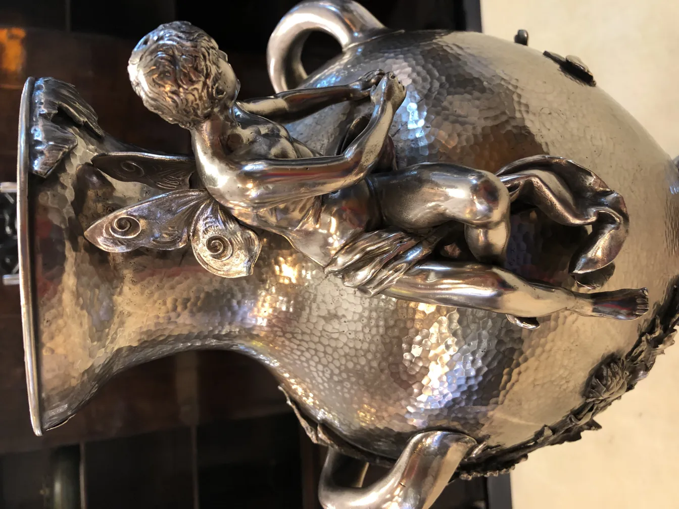 antique vases featuring ornate relief figures and detailed accents