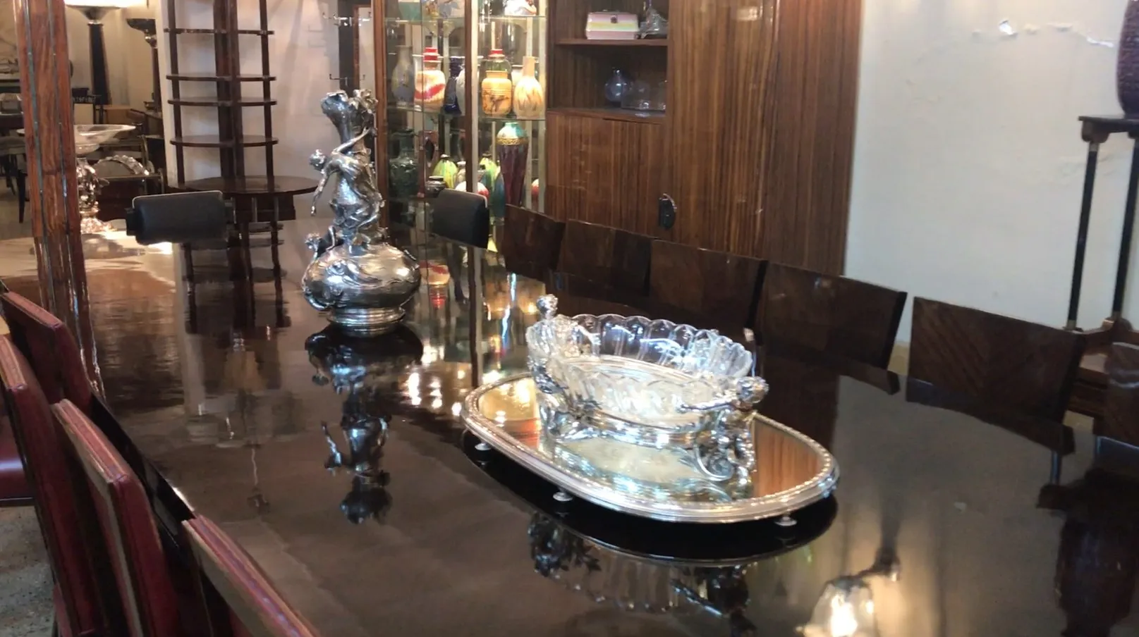Two antique art nouveau vases displayed on a table