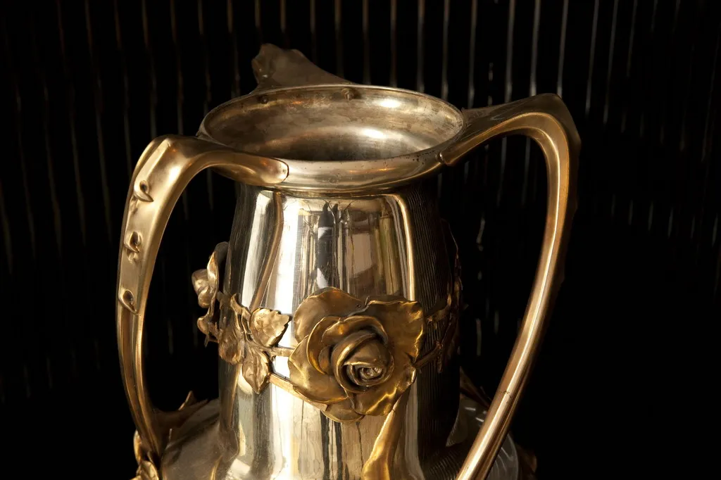 Two antique vases with artistic design and an elegant finish.