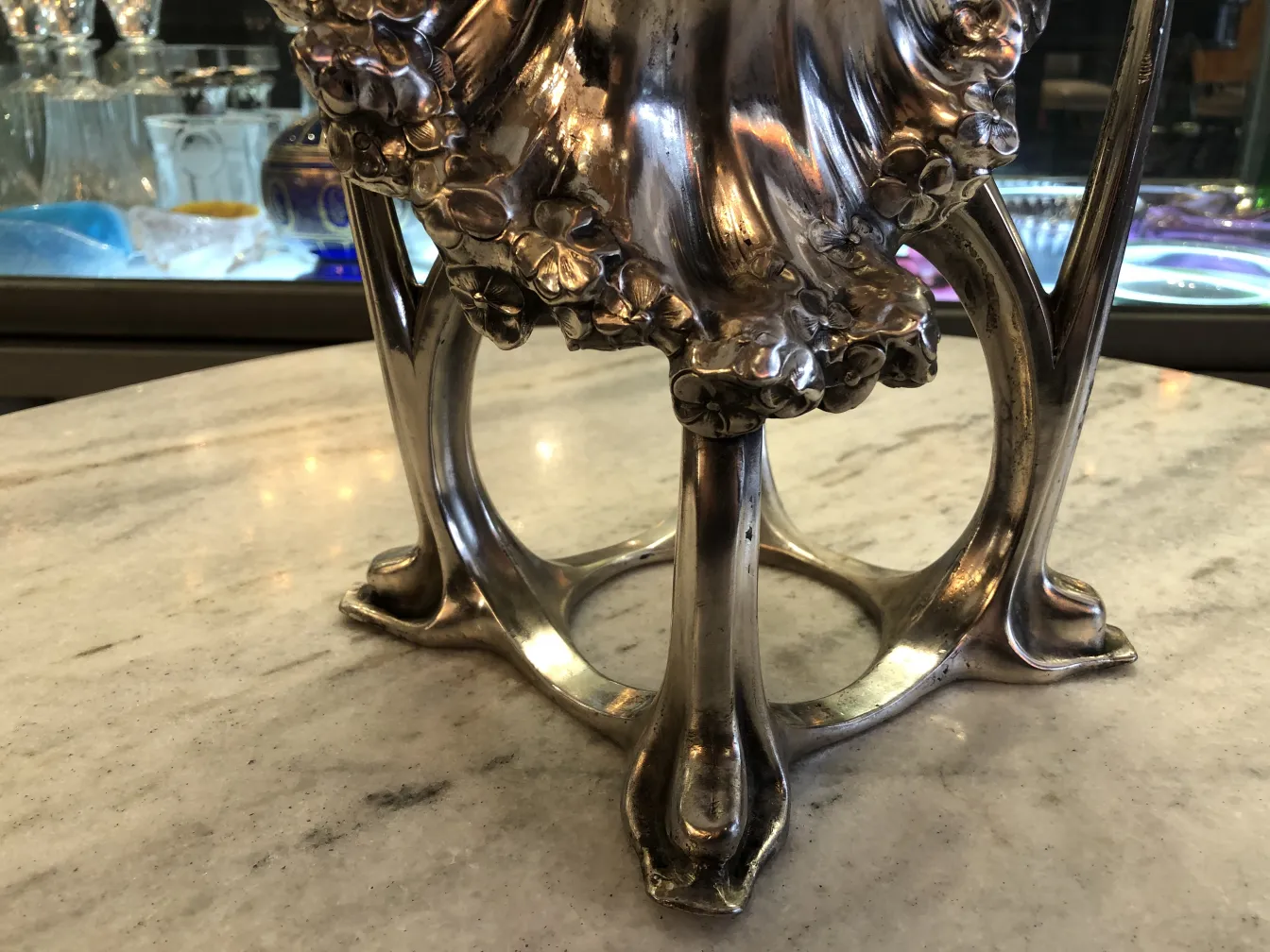 antique vase with elegant base, floral details, classic setting