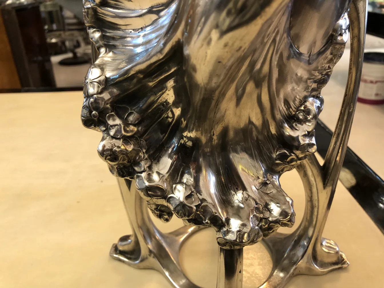 Antique vase featuring floral and ornamental details, enhancing a classic atmosphere.