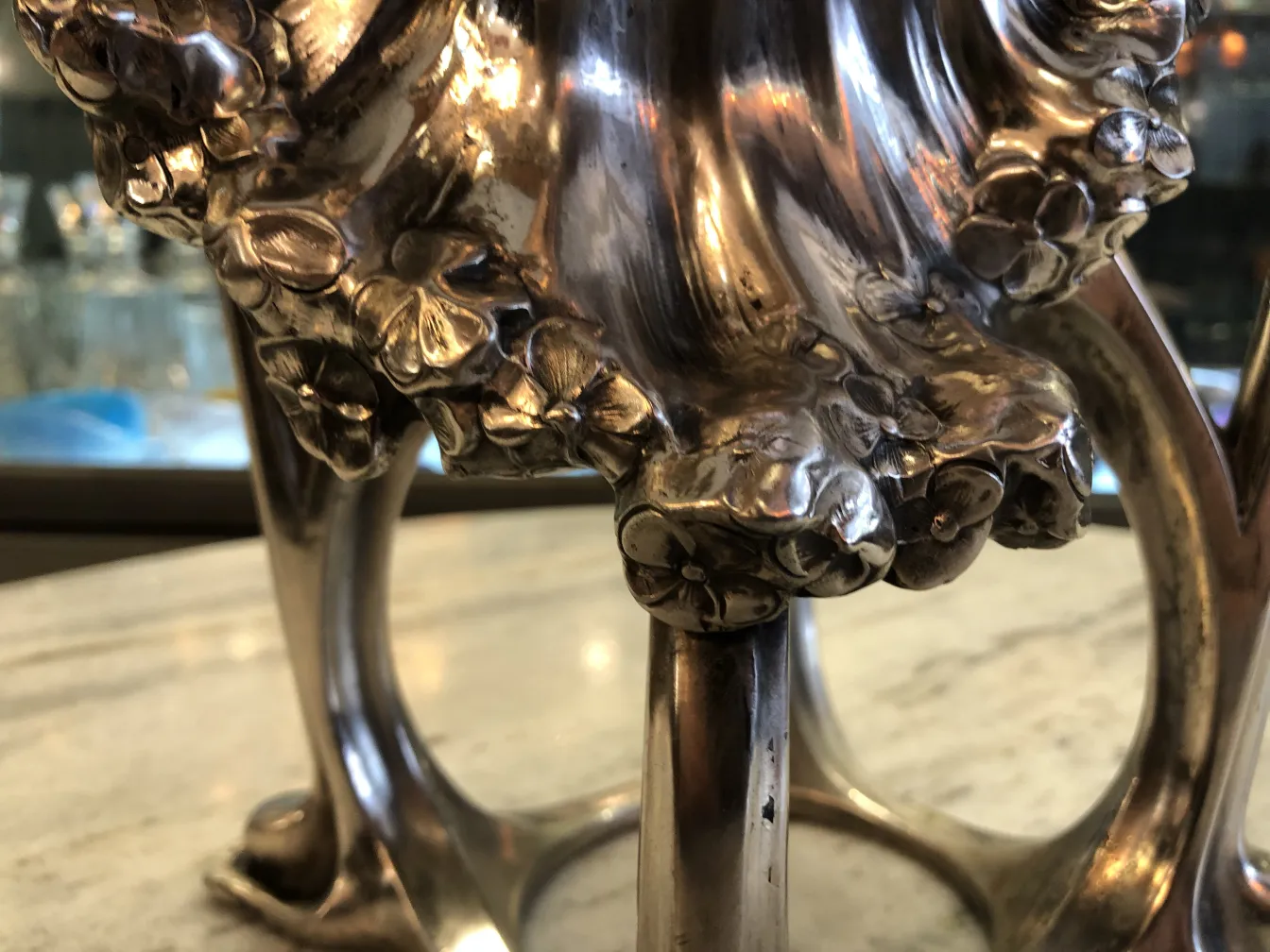 antique vase with detailed floral decoration, elegant setting