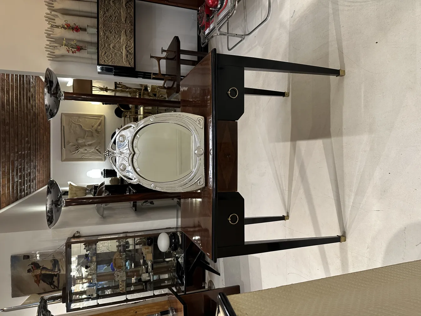 Antique mirror with art nouveau design in an elegant setting.