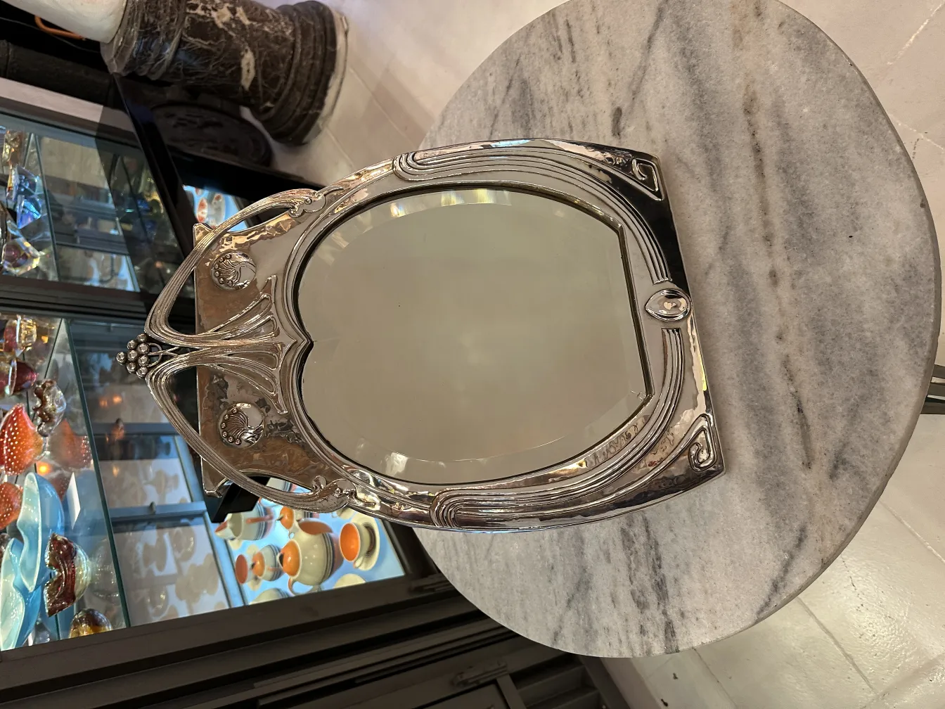 antique mirror with an ornate frame and details