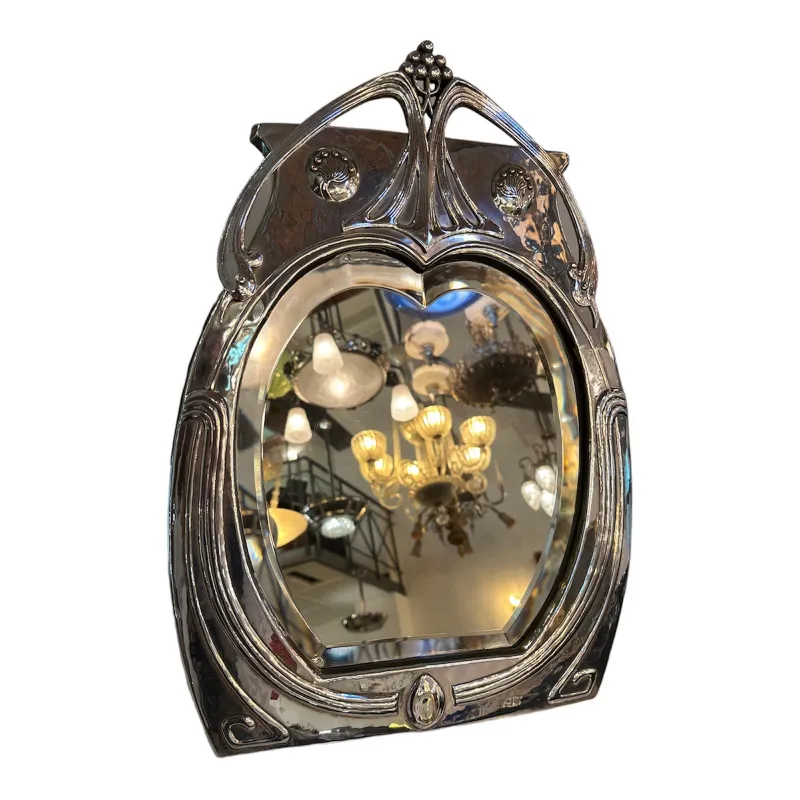 antique Art Nouveau mirror with ornamental details